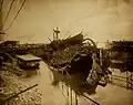 The largely destroyed bow of USS Maine