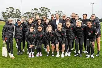 Rodman with the U.S. national team and now Second Gentleman, Doug Emhoff, July 2023