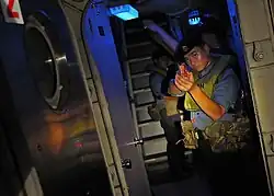 A Royal Brunei Navy sailor watch as passageway aboard USCGC Mellon (WHEC-717) during CARAT 2010.