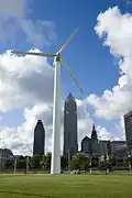 Closeup photo of the wind turbine against the Cleveland skyline