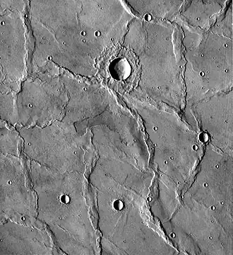 Wrinkle ridges in Hesperia Planum, Mars, as seen by Viking. The wrinkle ridges trend in different directions, so compressional forces may have changed direction over time.