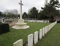 A photo of some tombstones on a cemetery