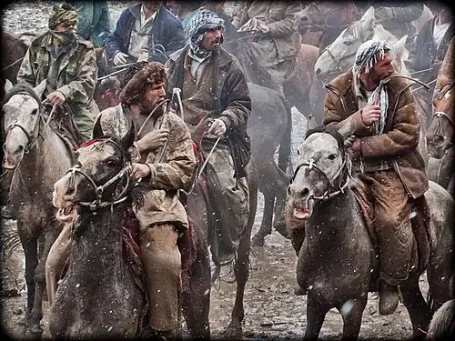 Fur clothing by men during a game of buzkashi