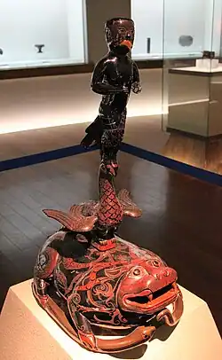 Lacquered yuren (羽人) figure on a toad stand