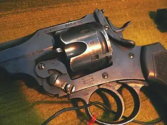 Close up of the cylinder (including thumb catch) on a Webley Mk VI service revolver