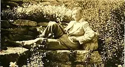 Arnold-Forster reclining in a garden in Italy around 1911