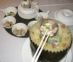 Another winter melon soup served from a carved melon bowl