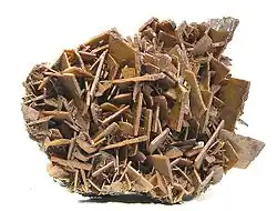 A plate of very sharp, chocolate-brown crystals of wulfenite to 1.5 cm on edge