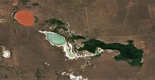 Red lake Kyzyltuz (Akkuly District) in the upper left
